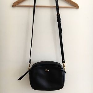 Minimalist black Roots leather crossbody bag